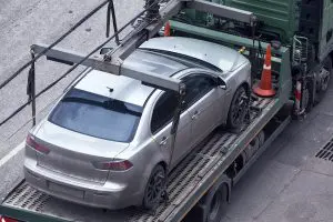 Car on platform of tow truck